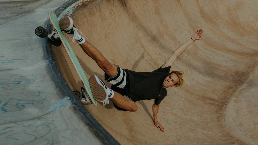 Slide Surfskates rider carving a concrete bowl with surf-inspired style and flow