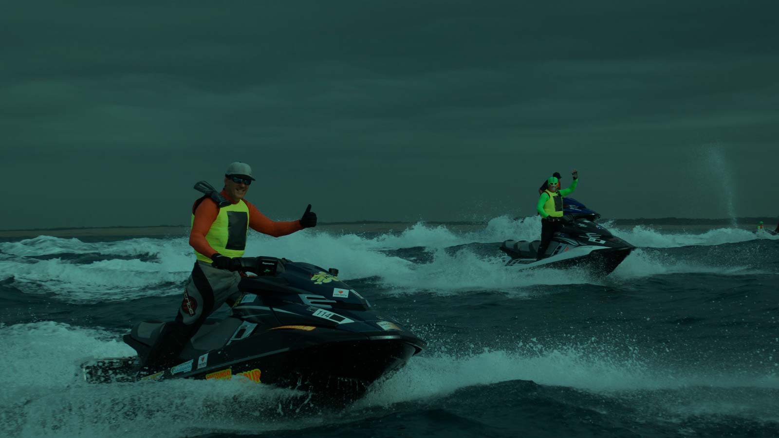 Jetski family speeding through the calm waters