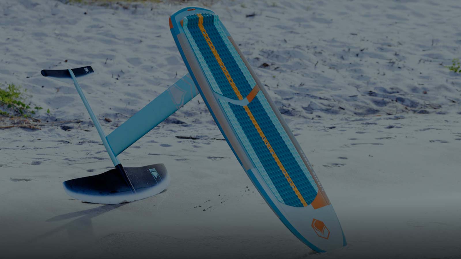 Hydrofoil board with attached wing. Sandy beach.